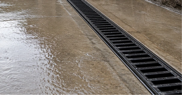 Drainage contractor evaluating water flow at a Los Angeles property