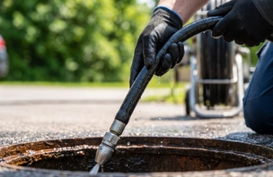 Professional hydro-jetting equipment cleaning a sewer line